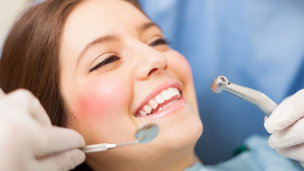 A woman at a dental clinic for a professional dental implant cleaning