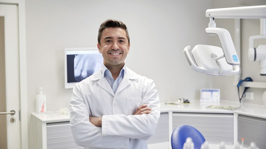 A dentist smiling in a family dental clinic in Wellawatte