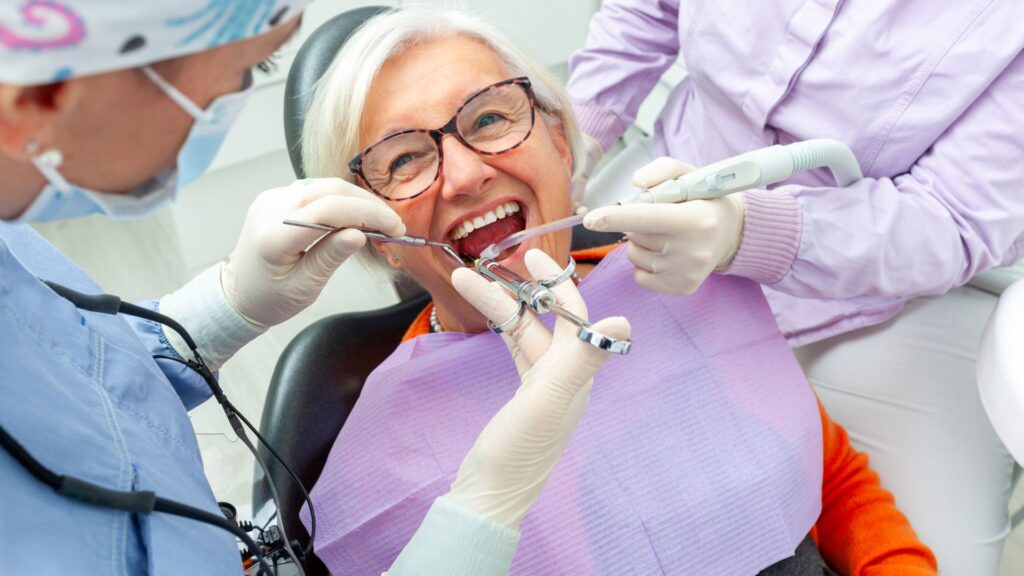 An elderly woman getting her teeth examined at a family dental clinic in Wellawatte.