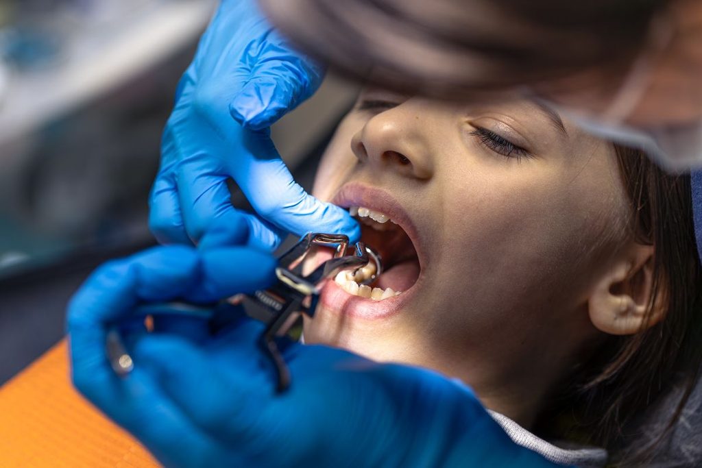 dentist treating patient for a broken tooth