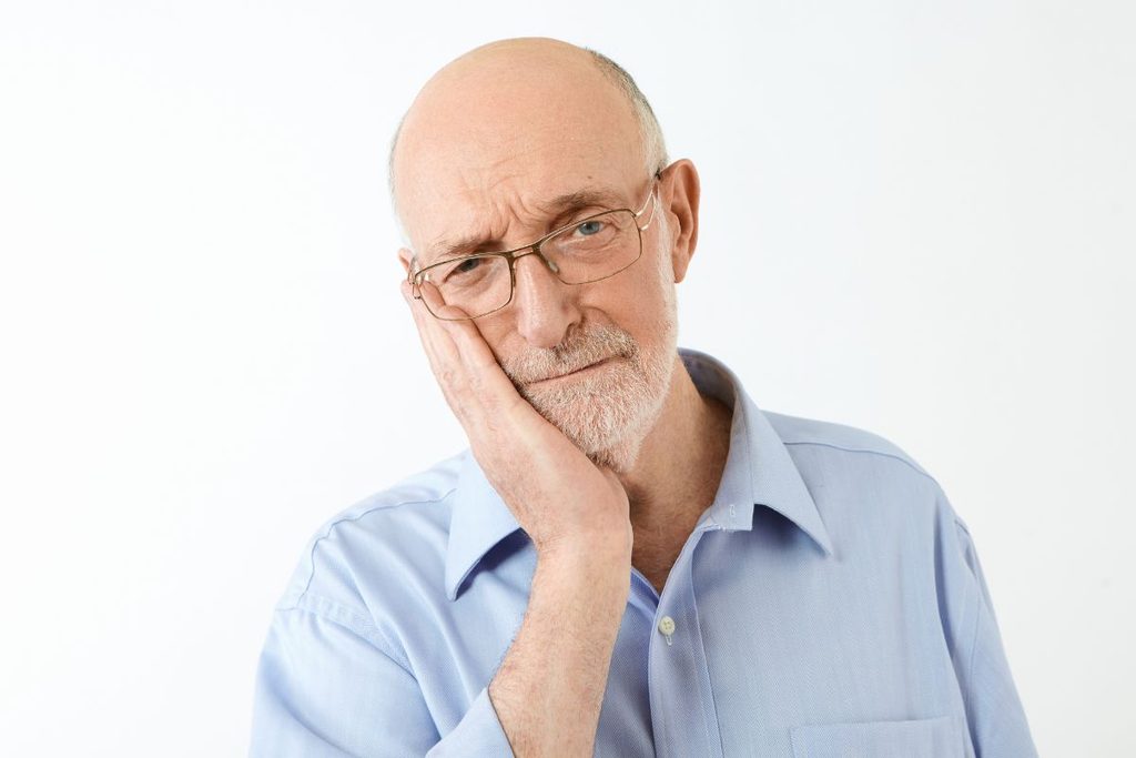 Man in discomfort due to jaw pain 